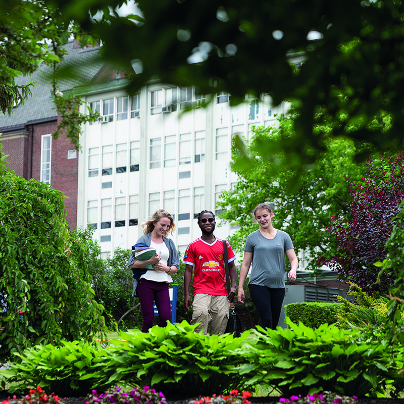 Students walking on campus - Spring