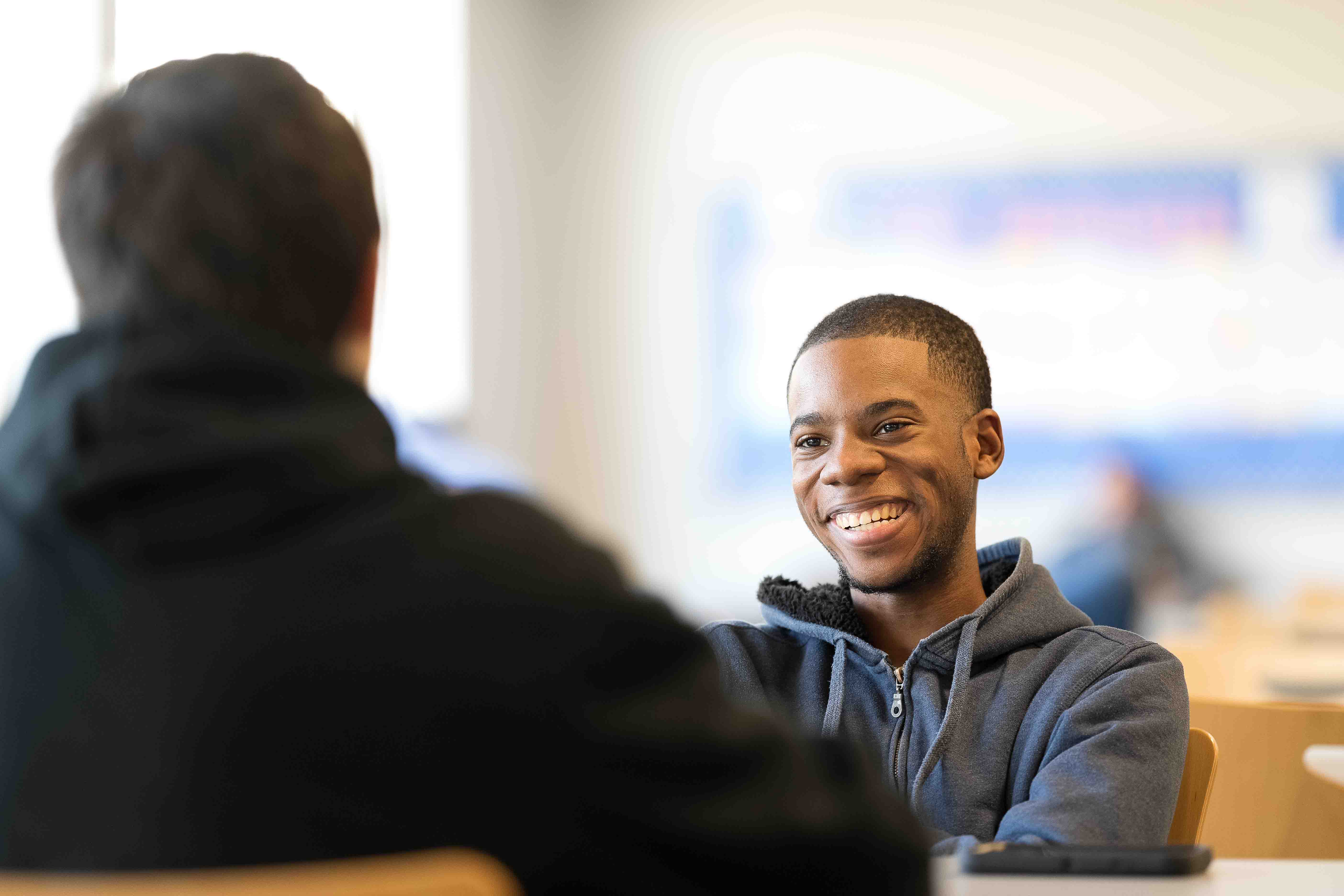 Smiling student in the caf