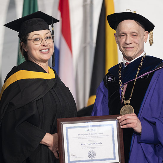 Stacy Okada and MassBay President Dr. David Podell