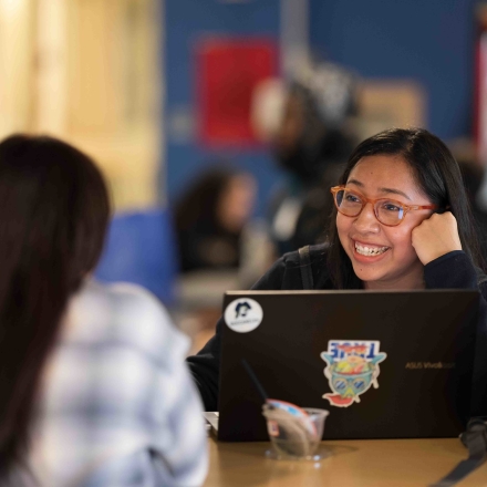 Young female on computer in caf