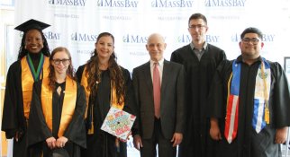 MassBay President David Podell with students at the 62nd Commencement ceremony