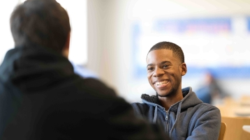 Smiling student in the caf