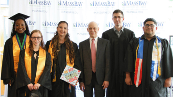 MassBay President David Podell with students at the 62nd Commencement ceremony