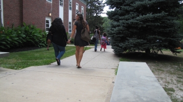 Two women walking outside